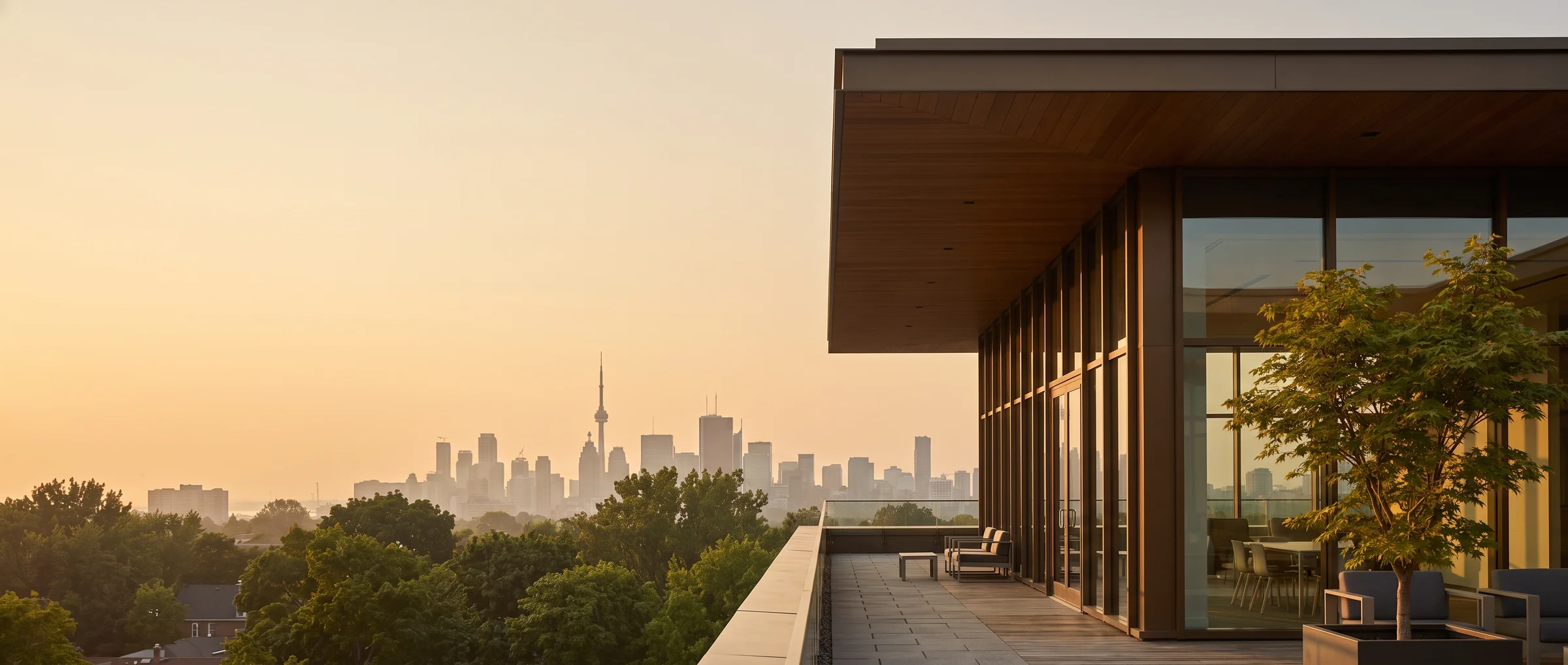 Warm evening light over the city and a modern office terrace